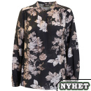 Blus med vackert mnster p svart botten